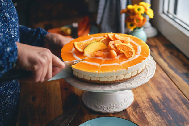 istock Creamy Orange Cheesecake with Whipped Cream 1357725602