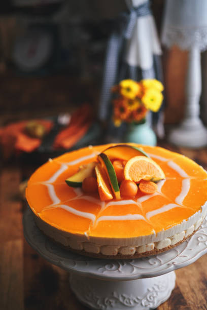 istock Creamy Orange Cheesecake with Whipped Cream 1357725624