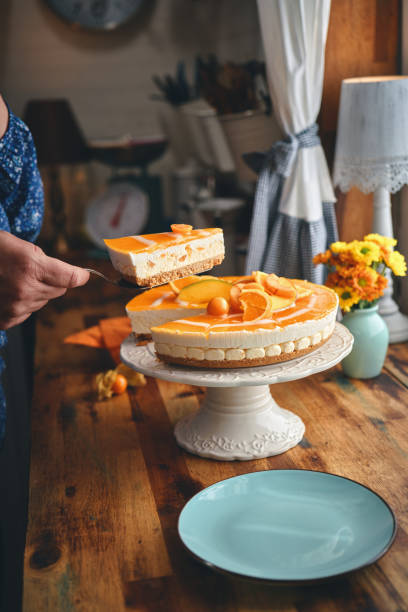 istock Creamy Orange Cheesecake with Whipped Cream 1357725645