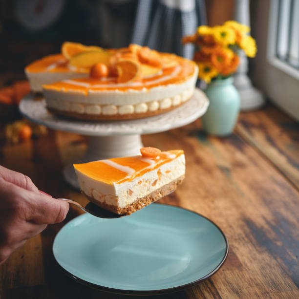 istock Creamy Orange Cheesecake with Whipped Cream 1357725654