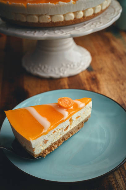 istock Creamy Orange Cheesecake with Whipped Cream 1357725656