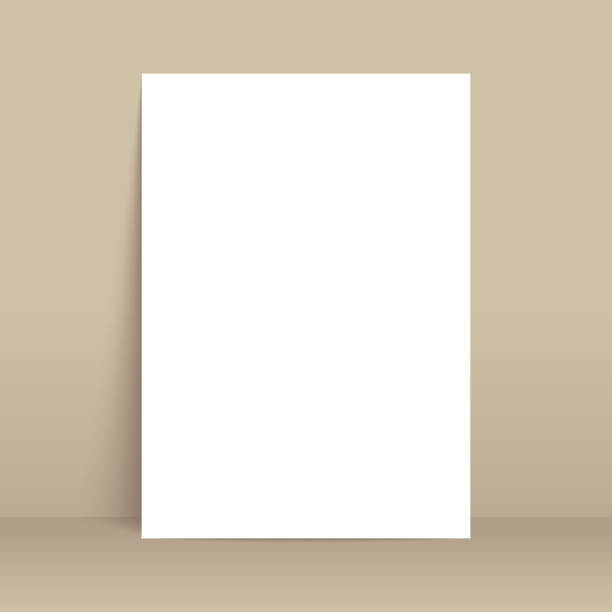 istock White poster mockup standing on the floor near brown wall. Blank Canvas Mockup for design 1357725790