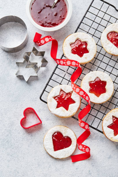 istock Classic Linzer Christmas Cookies with raspberry or strawberry jam on light background. 1357726135