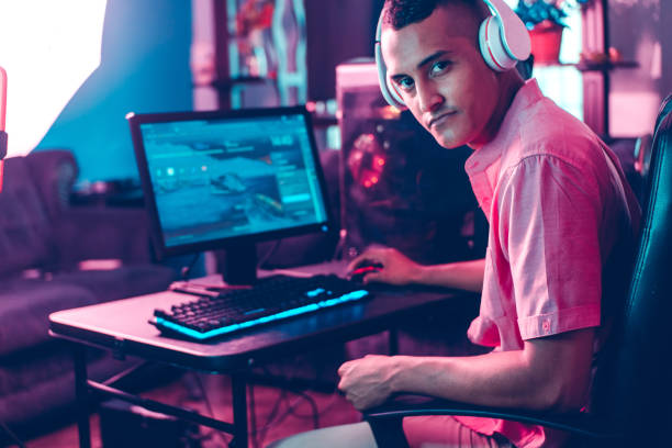 istock Young latinx man gamer looking at camera. 1357726985