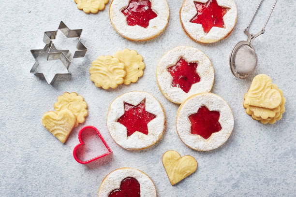 istock Classic Linzer Christmas Cookies with raspberry or strawberry jam on light background. 1357727179