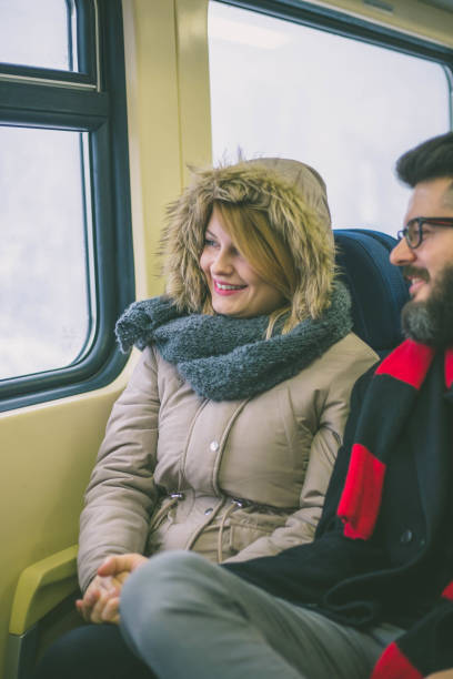 istock Couple sitting in the train 1357729921