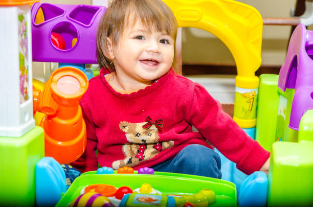 istock Baby mixed race girl playing 1357731606