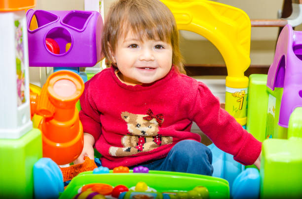 istock Baby mixed race girl playing 1357733451