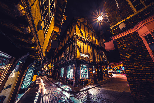 The Shambles, a medieval street preserved in the heart of the English city of York, still busy with boutique shops and cafes.