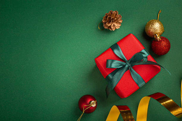 istock Christmas composition with present and decorations in red, green, golden colors 1357740047