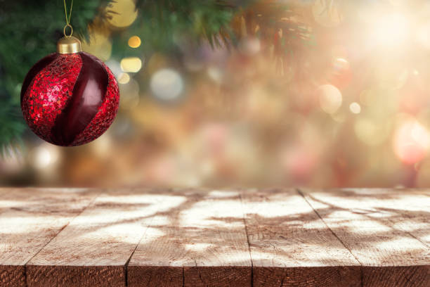 istock Empty rustic wooden table and Christmas ornament on Christmas tree background. 1357741637