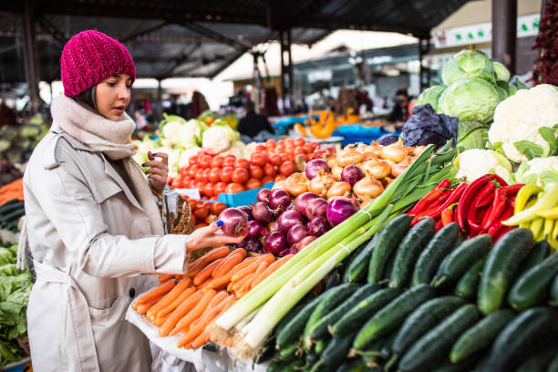 istock A young woman shopping for vegetables 1357746286
