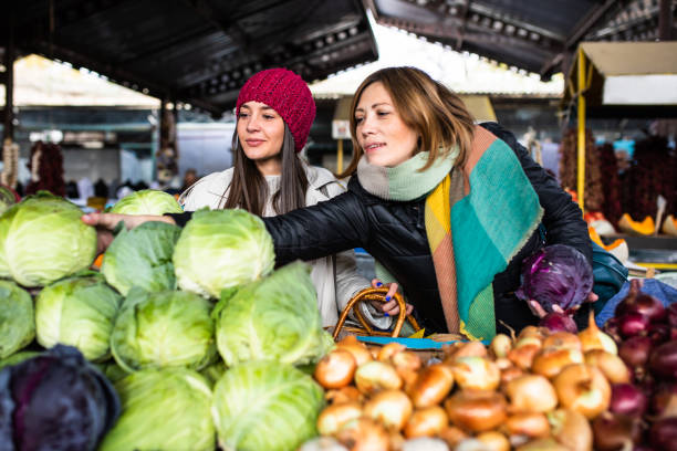 istock Women buying cabbage 1357746396