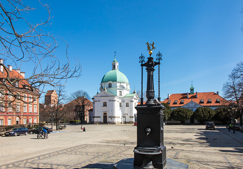 Church of St. Casimir (Sakramentek) in Warsaw built in 1688-1692 according to the design of the eminent architect Tylman Gameren with an antique well on the square in front of the church
