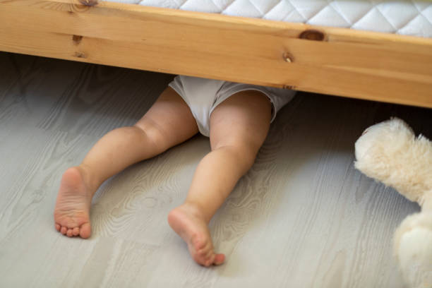 istock Child hiding under the bed 1357751566