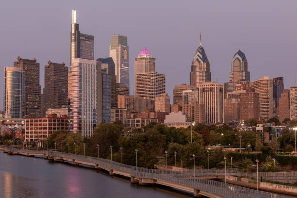 istock Philadelphia Downtown skyline with the Schuylkill river. Beautiful Sunset Light. Schuylkill River Trail in Background. City skyline glows under the beautiful sunset light. Cityscape. PA, USA. 1357751843