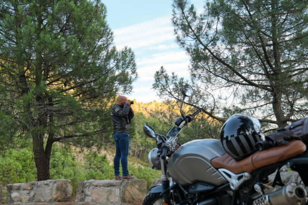 istock A handsome man taking a photo during his motorcycle trip 1357751932