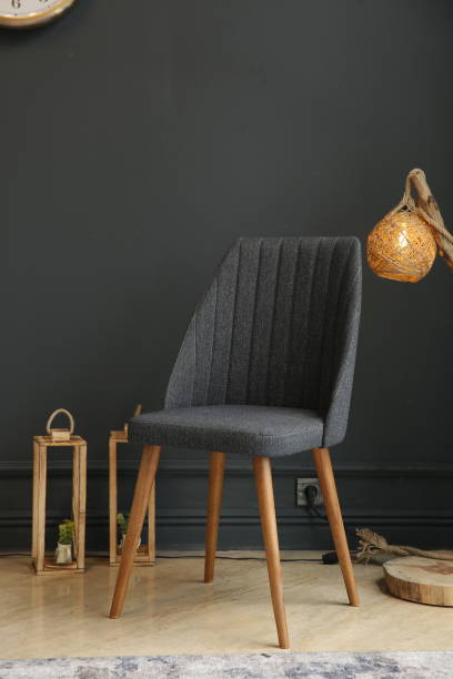 istock Black interior with blank wall, armchair and decor 1357755390