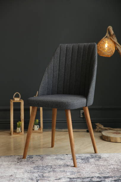 istock Black interior with blank wall, armchair and decor 1357755419