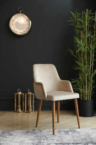 istock Black interior with blank wall, armchair and decor 1357755548