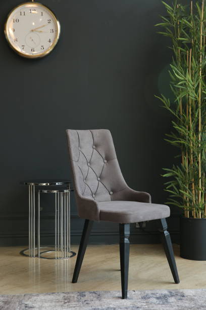 istock Black interior with blank wall, armchair and decor 1357755663