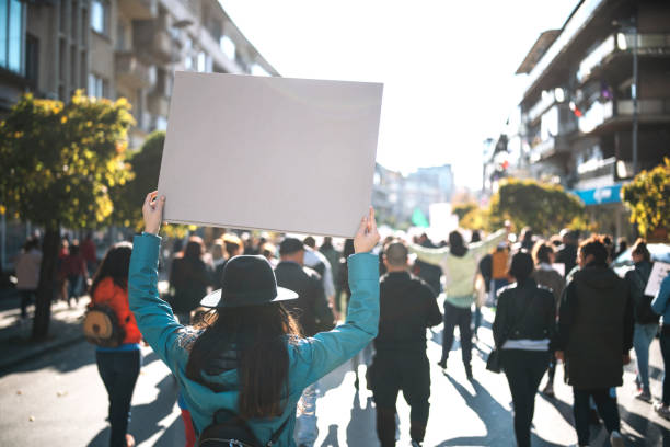 istock Rear View Of Woman On A Protest 1357755701