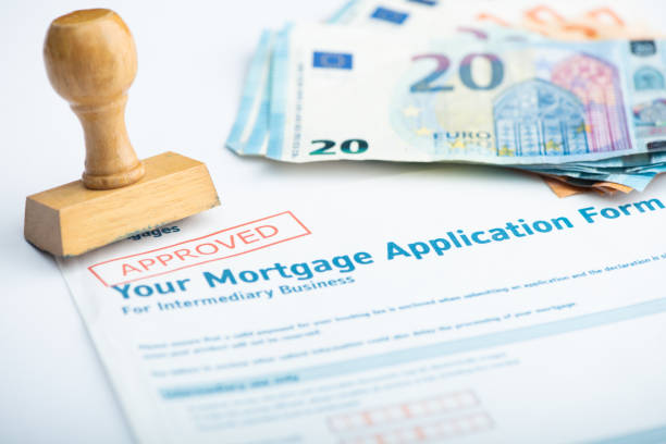 istock Euro money calculator and a stamp on a table desk 1357755869