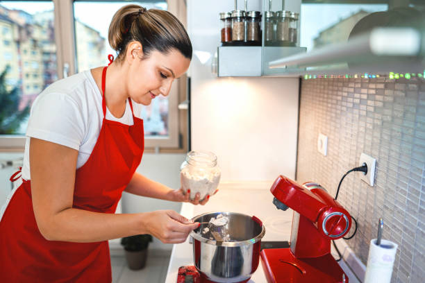 istock Beautiful mum preparing macaroon dough in her home kitchen 1357759822