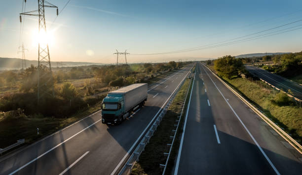 istock Lorry Truck on a countryside highway 1357760539