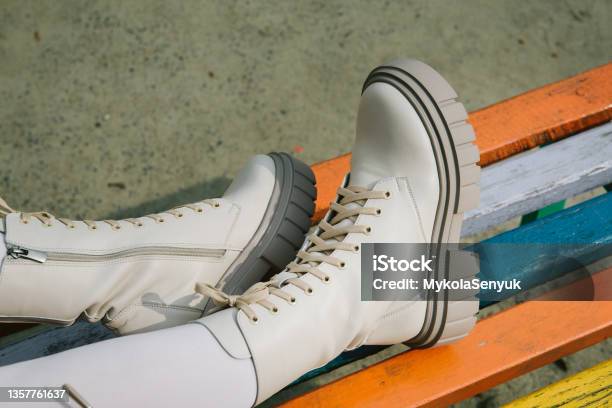Female Legs Wearing White Fashion Boots With Laces Stock Photo - Download Image Now - Elegance, Boot, Jeans