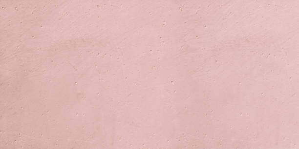 istock Panoramic wall on concrete or stucco on pink background. 1357763066