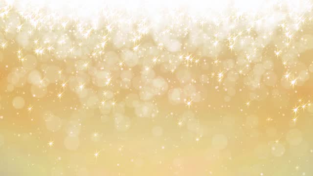 Sparkling light particles on golden background