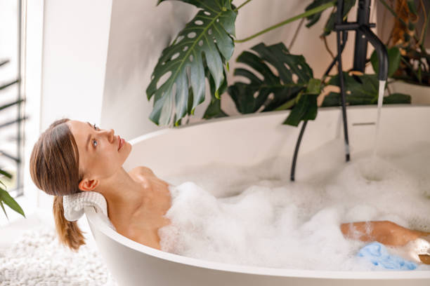 istock Relaxed young woman bathing while spending time indoors at luxury spa resort 1357768846