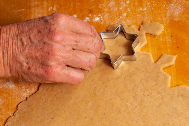 Old women preparing Christmas cookies at home