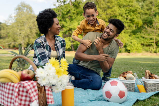 istock Happy family spending a spring day on picnic 1357774008