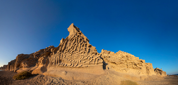 View at Vlychada beach volcanic ash sand rock formation on Santorini island in Greece