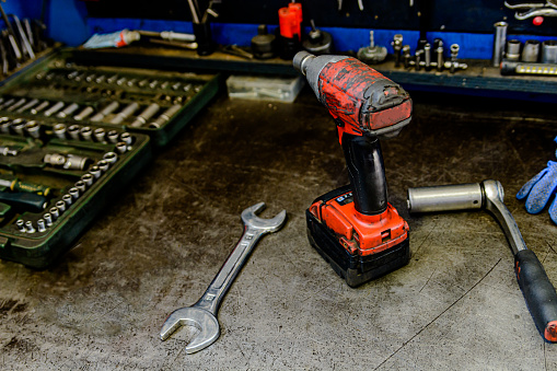 A Close-up View of Drill in an Auto Mechanic Workshop.