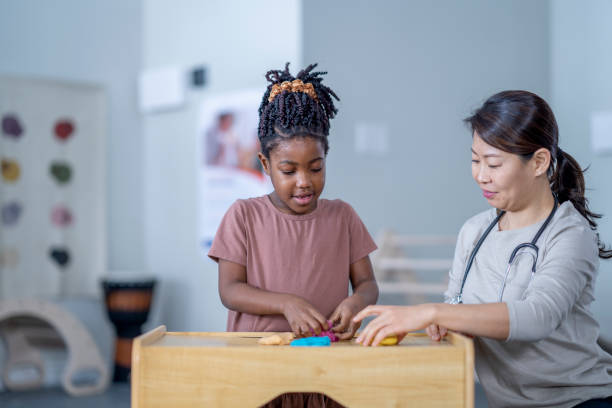 istock Little Girl in a Therapy Session 1357781233