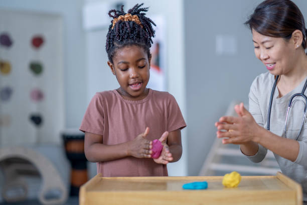 istock Little Girl in a Therapy Session 1357781235