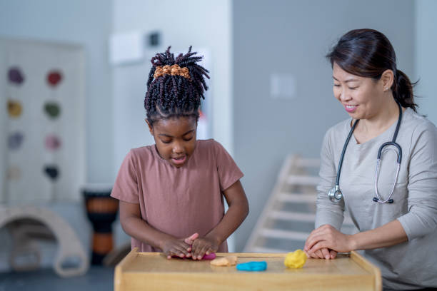 istock Little Girl in a Therapy Session 1357781237