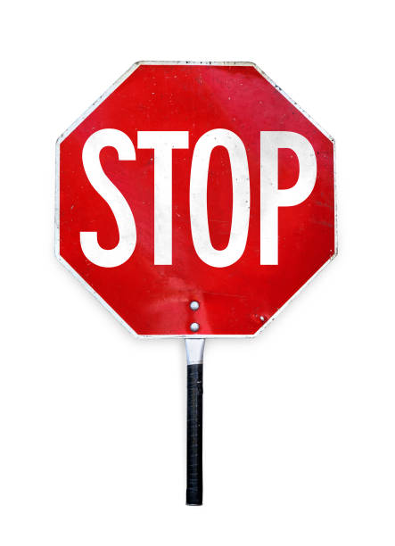 Aged hand-held stop sign or paddle Sign used for traffic control by crossing guards, police or work zones. Red and white metal texture sign in octagon shape and a pole to hold. Isolated on white. crossing guard stop signs stock pictures, royalty-free photos & images