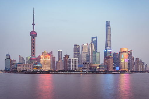 Shanghai, China - December 31, 2016: City center skyline by the Huangpu River at sunset time.