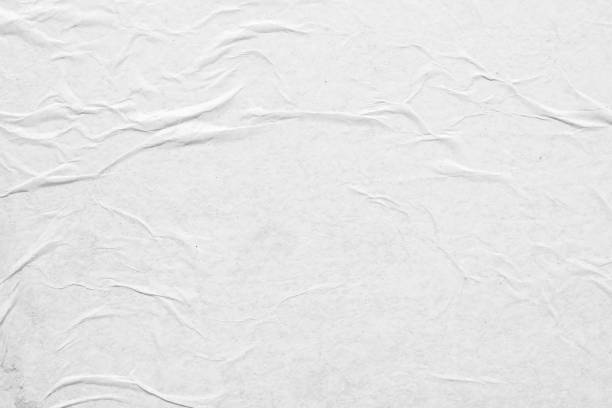 istock white crumpled and creased paper poster texture background 1357785669