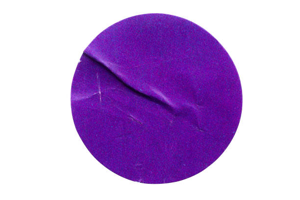 Blank purple round adhesive paper sticker label isolated on white background