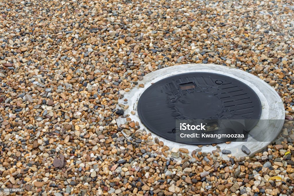 Septic tank cover underground waste treatment system Poisonous Stock Photo