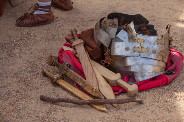 roman military personal equipment pilled over ground. historical reenactment - pilled imagens e fotografias de stock