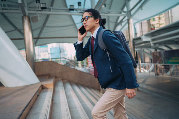 istock Businessman talking on a phone on the move 1357790969