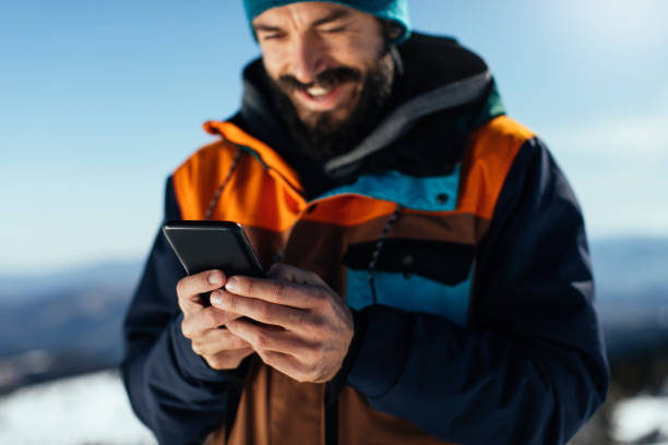 istock Telling his group about the best of ski runs 1357791078