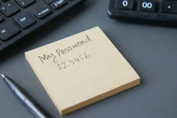 writing password on a sticky note writing password on a sticky note , password stock pictures, royalty-free photos & images