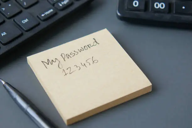 Photo of writing password on a sticky note
